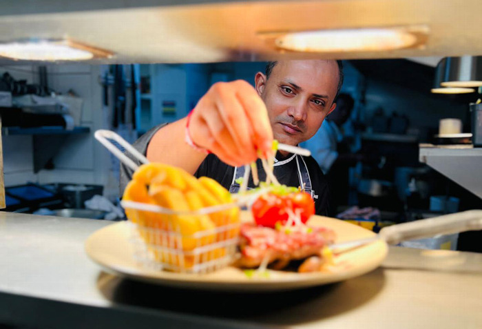 A chef in the elm tree in kitchen